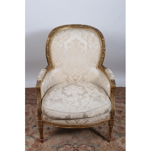 654 - A CONTINENTAL GILTWOOD AND UPHOLSTERED ARMCHAIR the flowerhead and foliate carved frame with upholst... 