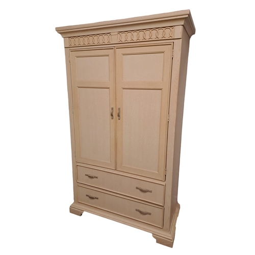 708 - **WITHDRAWN** A CREAM PAINTED CUPBOARD the moulded cornice above a pair of panel doors containing sh... 