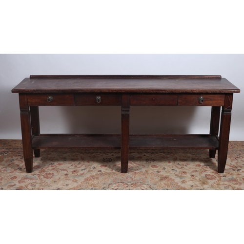 713 - A HARDWOOD SIDE TABLE of rectangular outline the shaped top with moulded back above two frieze drawe... 