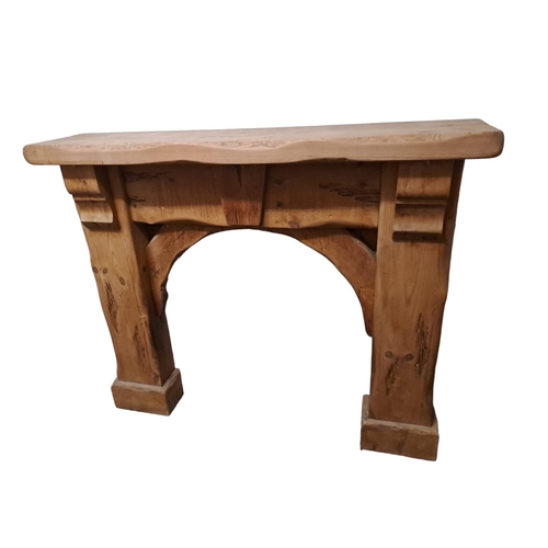 716 - A RUSTIC PINE CHIMNEY PIECE the rectangular shaped shelf above a moulded frieze on rectangular jambs... 