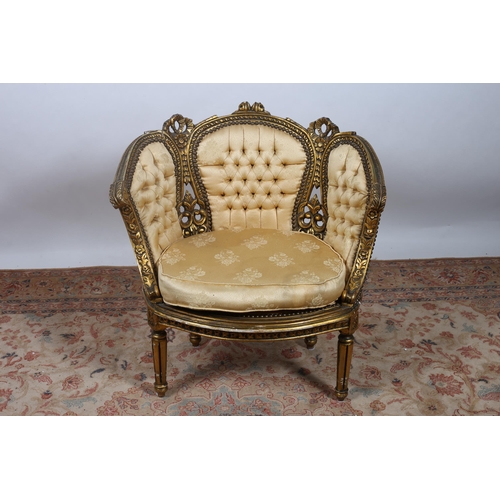 717 - A CONTINENTAL GILTWOOD AND UPHOLSTERED TUB SHAPED CHAIR with deep buttoned upholstered back and seat... 