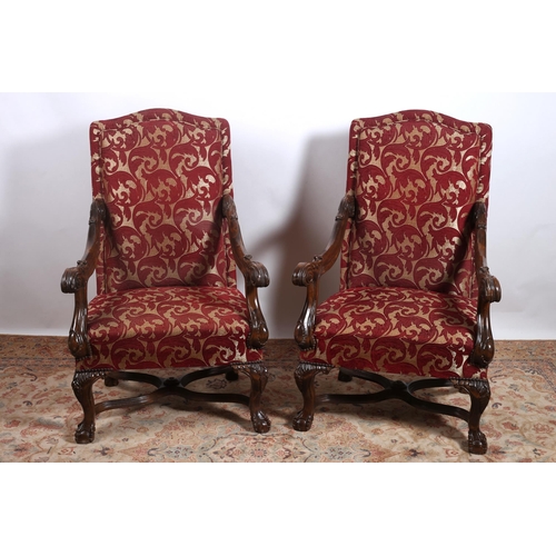 78 - A PAIR OF CONTINENTAL STAINED WOOD AND UPHOLSTERED ARMCHAIRS each with a rectangular arched upholste... 