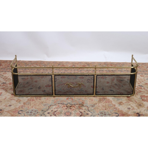 79 - **WITHDRAWN** A BRASS FENDER the cylindrical top rail above a black mesh frieze with gilt brass moun... 