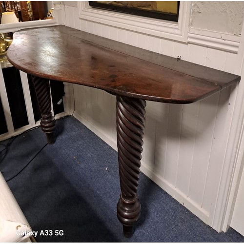 370 - **WITHDRAWN** A 19TH CENTURY MAHOGANY CONSOLE TABLE of serpentine outline the shaped top raised on f... 