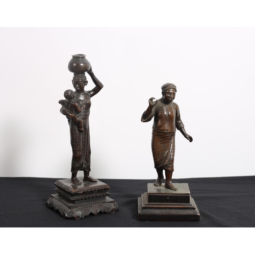 456 - A 19TH CENTURY BURMESE BRONZE FIGURE modelled as a female holding a child, a 19th century bronze fig... 