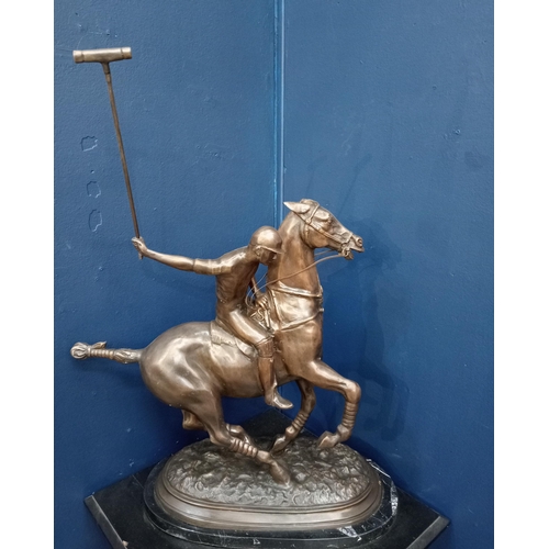 382 - A BRONZE STATUE modelled as a polo player on horseback shown on a naturalistic base with marble plin... 