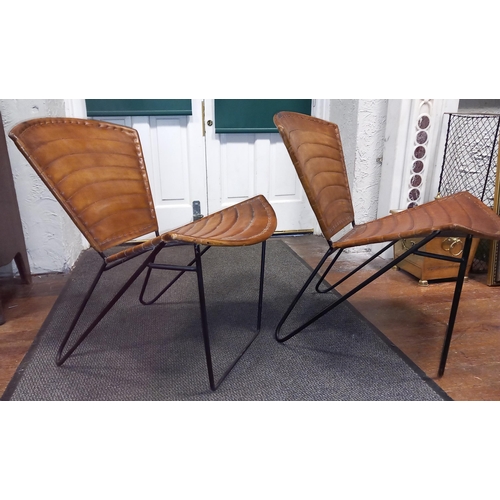 392 - A PAIR OF HIDE UPHOLSTERED AND METAL CHAIRS each with a shaped back and seat with panelled hide upho... 