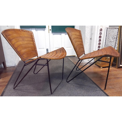 392 - A PAIR OF HIDE UPHOLSTERED AND METAL CHAIRS each with a shaped back and seat with panelled hide upho... 