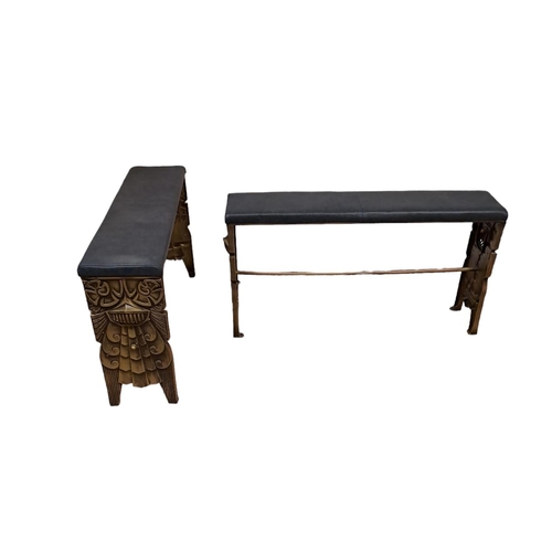 394 - A PAIR OF ART DECO STYLE EMPIRE PATTERN CAST IRON BENCHES each with an upholstered seat on cast meta... 