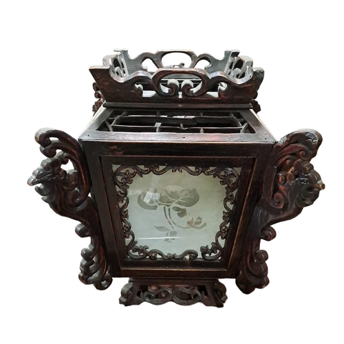 395 - A CHINESE STAINED WOOD AND GLAZED HANGING LANTERN the pierced open work frame with etched glass pane... 