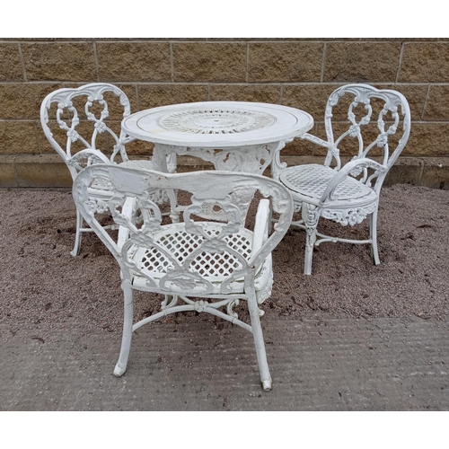 402 - A FOUR PIECE CAST IRON PATIO SUITE comprising a cast iron table the circular pierced top on splayed ... 