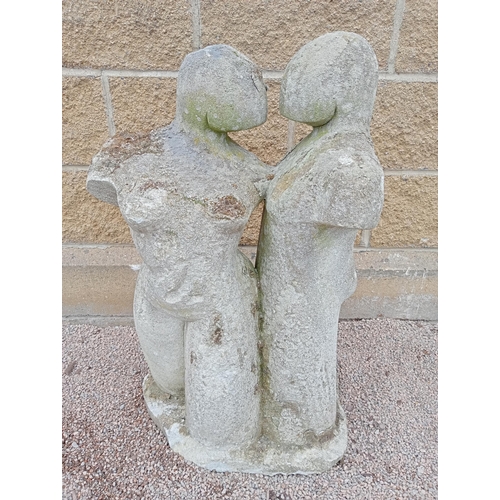 409 - A COMPOSITION SANDSTONE GROUP modelled as a male and female shown standing on a naturalistic base 
8... 