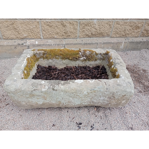 414 - A STONE TROUGH of rectangular outine
29cm (h) x 56cm (w) x 34cm (d)