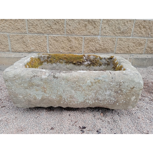 414 - A STONE TROUGH of rectangular outine
29cm (h) x 56cm (w) x 34cm (d)