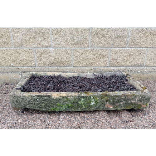 415 - A 19TH CENTURY LIMESTONE TROUGH of rectangular outline 
22cm (h) x 100cm (w) x 42cm (d)