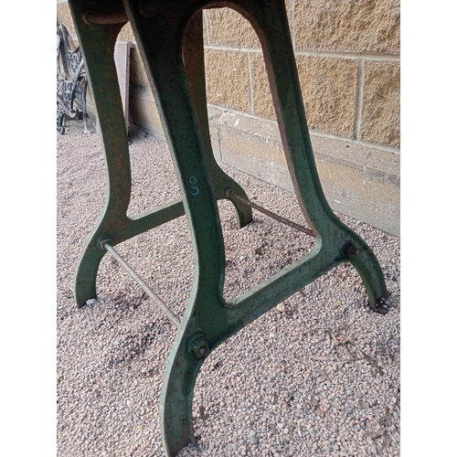 422 - A VINTAGE CAST IRON AND MARBLE TABLE of rectangular outline the veined marble top raised on a cast i... 