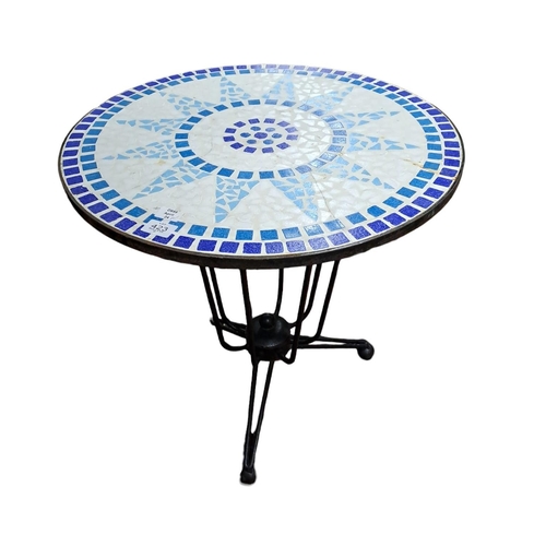 423 - A THREE PIECE WROUGHT IRON AND TUBULAR PATIO SUITE comprising a circular table the shaped top inset ... 