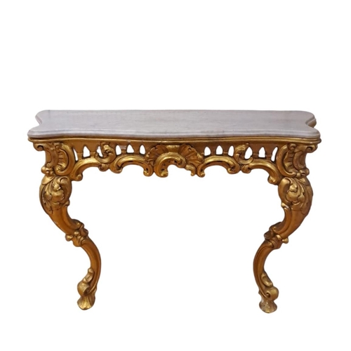 45 - A 19TH CENTURY GILTWOOD AND GESSO CONSOLE TABLE of serpentine outline the veined marble top above a ... 