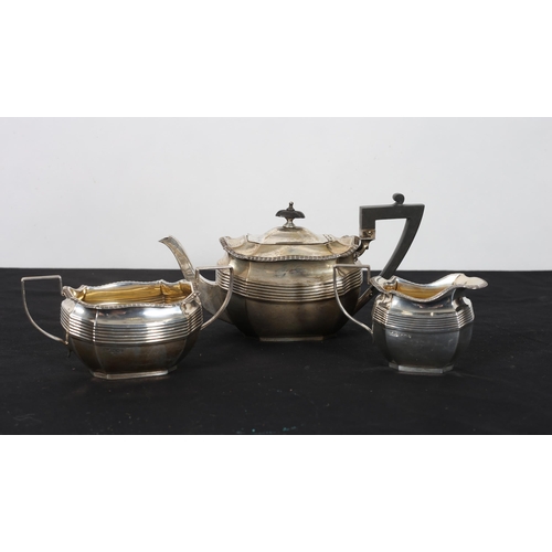 484 - A THREE PIECE SILVER AND GILT LINED BACHELOR'S TEA SERVICE Sheffield 1945