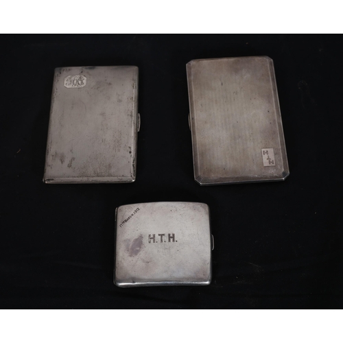 490 - TWO SILVER ENGINE TURNED CIGARETTE CASES together with a similar example (3)