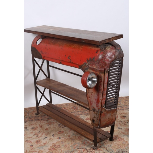53 - A VINTAGE METAL AND HARDWOOD OPEN FRONT THREE TIER SHELF in the form of a part Massey Ferguson Tract... 