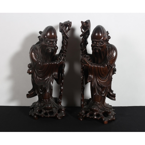 533 - A PAIR OF 19TH CENTURY CHINESE CARVED HARDWOOD FIGURES each modelled as a scholar
Each 46cm (h)