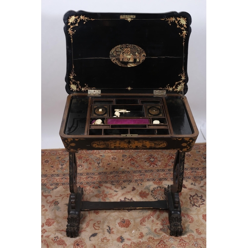 62 - A 19TH CENTURY BLACK LACQUERED AND GILT WORK BOX of serpentine outline the shaped lid containing com... 