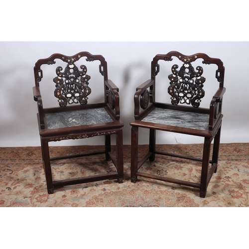 69 - A PAIR OF ORIENTAL ROSEWOOD AND MOTHER OF PEARL INLAID ELBOW CHAIRS each with a serpentine top rail ... 