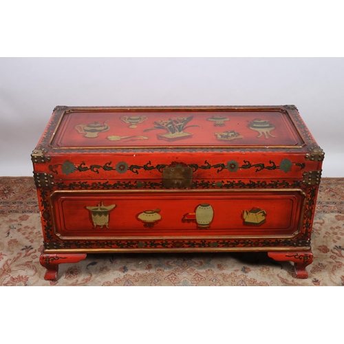 70 - A CHINESE RED LACQUERED POLYCHROME AND GILT BRASS MOUNTED TRUNK decorated overall with stylised flow... 