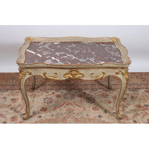 71 - A CONTINENTAL GILTWOOD AND POLYCHROME COFFEE TABLE of serpentine outline the shaped dish top with re... 