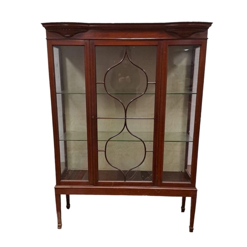 1 - AN EDWARDIAN MAHOGANY AND SATINWOOD INLAID DISPLAY CABINET the rectangular bowed cornice above an as... 