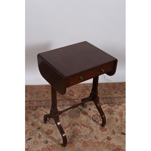 175 - A REGENCY DESIGN MAHOGANY DROP LEAF TABLE of rectangular outline with hinged leaves above a frieze d... 