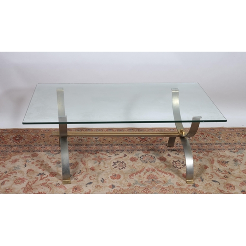 179 - A VINTAGE CHROME AND GLAZED COFFEE TABLE of rectangular outline the shaped top raised on U-shaped su... 