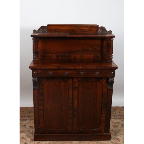 195 - A GOOD REGENCY ROSEWOOD SIDE CABINET the superstructure with moulded shelf raised on cylindrical fol... 