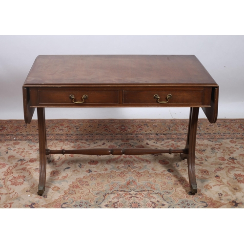 196 - A GEORGIAN STYLE MAHOGANY CROSSBANDED SOFA TABLE the rectangular hinged top above two frieze drawers... 