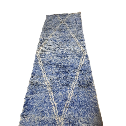 633 - A SILVER SHAGGY PILE RUG 200cm (l) x 290cm (w) together with A BLUE SHAGGY PILE RUNNER 490cm (l) x 8... 