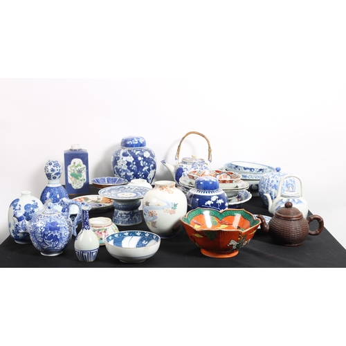 640 - A COLLECTION OF BLUE AND WHITE CHINA to include lidded jars, ginger jars, vases, chargers, teapots, ... 