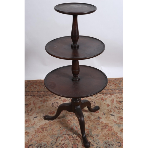 72 - A 19TH CENTURY MAHOGANY THREE TIERED GRADUATED DUMBWAITER each circular dish shelf joined by baluste... 