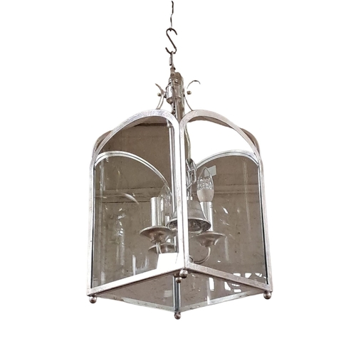 156 - A CHROME THREE LIGHT LANTERN of rectangular form with arched glazed panels 
60cm drop x 29cm (w) x 2... 