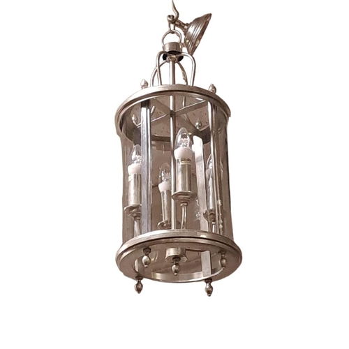 157 - A CHROME FOUR LIGHT LANTERN of cylindrical form with urn finials 
67cm drop x 26cm (d)