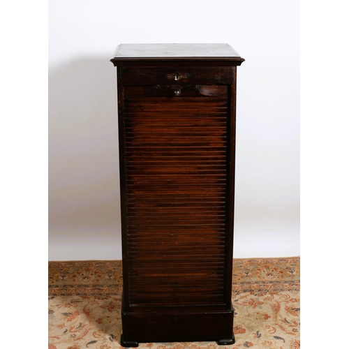 168 - A VINTAGE OAK FILING UNIT of rectangular outline the shaped top above a frieze drawer with tambour s... 