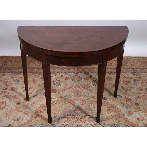 193 - A 19TH CENTURY MAHOGANY KINGWOOD INLAID FOLDOVER CARD TABLE of demi lune outline the shaped hinged t... 