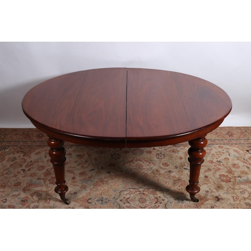 192 - A 19TH CENTURY MAHOGANY TELESCOPIC DINING TABLE of rectangular bowed outline the shaped top with rou... 