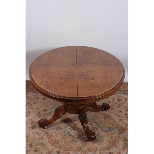 231 - A 19TH CENTURY BURR WALNUT POD TABLE of oval outline the shaped top above a baluster column on platf... 