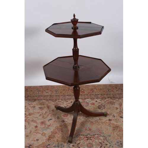 240 - A 19TH CENTURY MAHOGANY TWO TIER DROP LEAF DUMBWAITER of octagonal outline the hinged leaves joined ... 