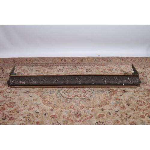 309 - AN ART NOUVEAU COPPER FIRE KERB the frieze embossed with stylised foliage on platform base 
15cm (h)... 