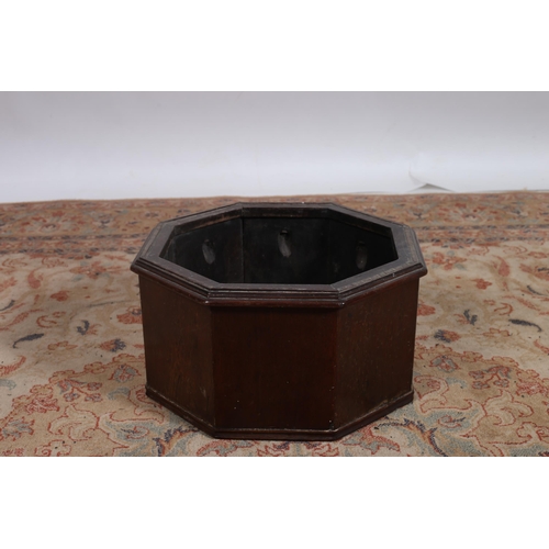 310 - A VINTAGE MAHOGANY PLANTER of octagonal outline the shaped top with moulded apron and base 
24cm (h)... 