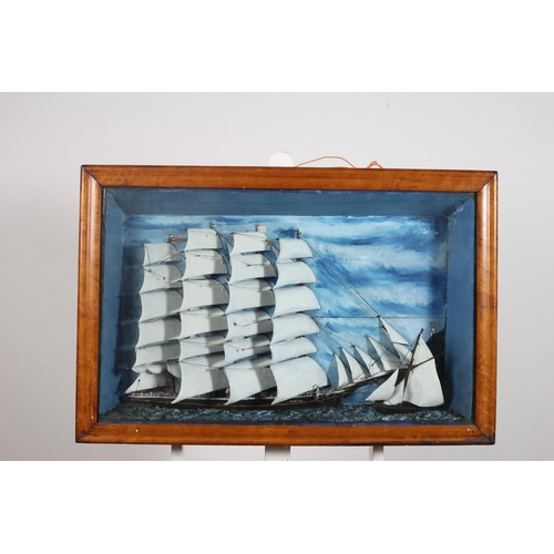 311 - BRITISH CLIPPER SHIP AND PILOT BOAT 19TH CENTURY off headlands with lighthouse 
In maple shadow box ... 