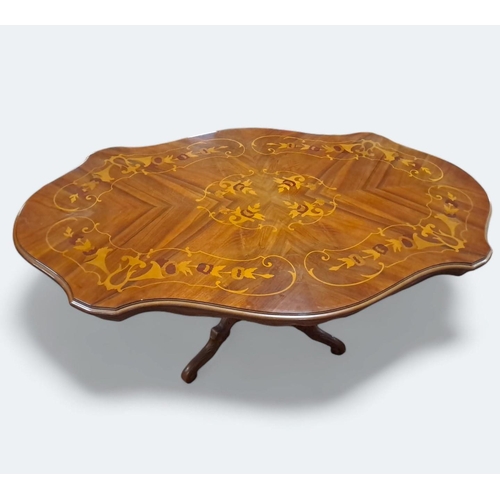 377 - A CONTINENTAL KINGWOOD AND MARQUETRY POD TABLE of serpentine outline the shaped top above a carved b... 