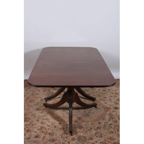 388 - A GEORGIAN STYLE MAHOGANY DINING TABLE of rectangular outline the shaped top with rounded corners an... 